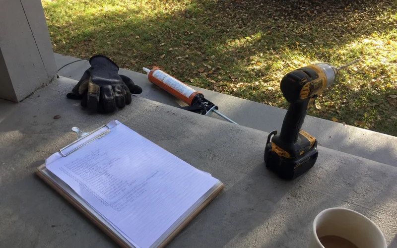 Checklist with caulk gun and drill