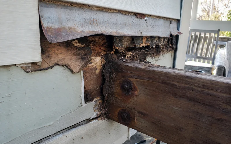 Rusted, pulling-away deck ledger connection