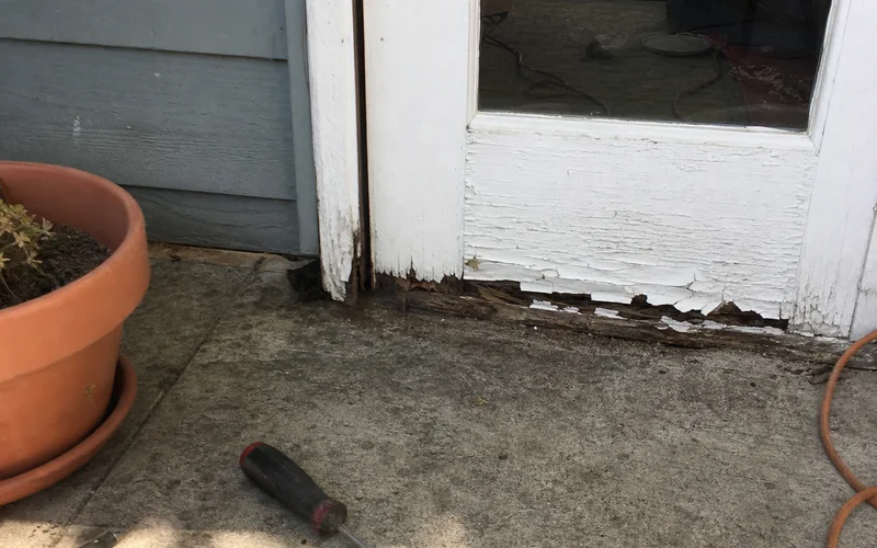 Rotted bottom rail of an old exterior door