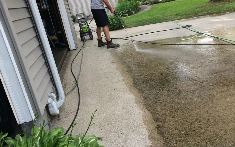 Concrete driveway with clean vs dirty contrast