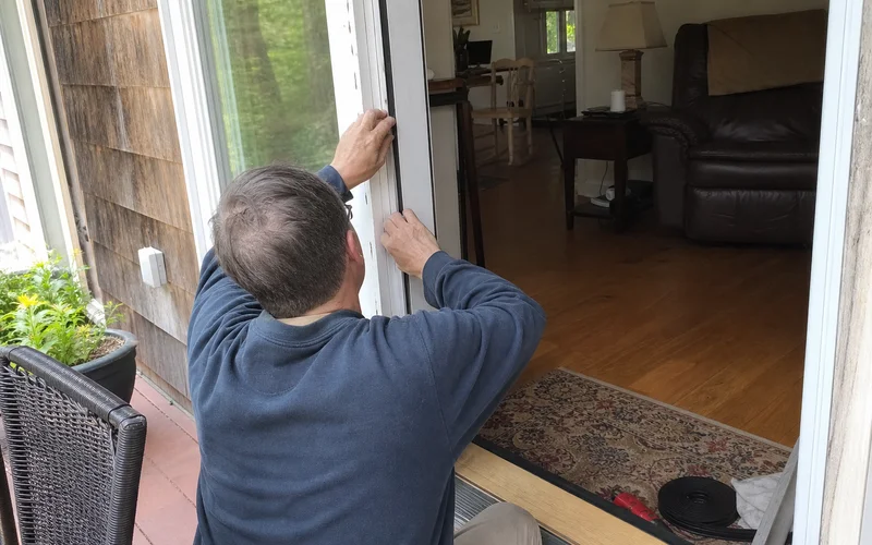 Installing new weatherstripping on a door jamb
