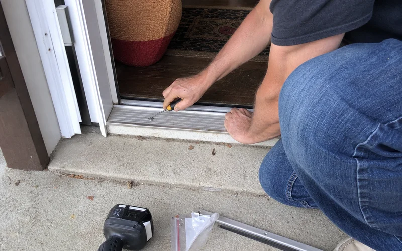 Replacing a worn door sweep at threshold