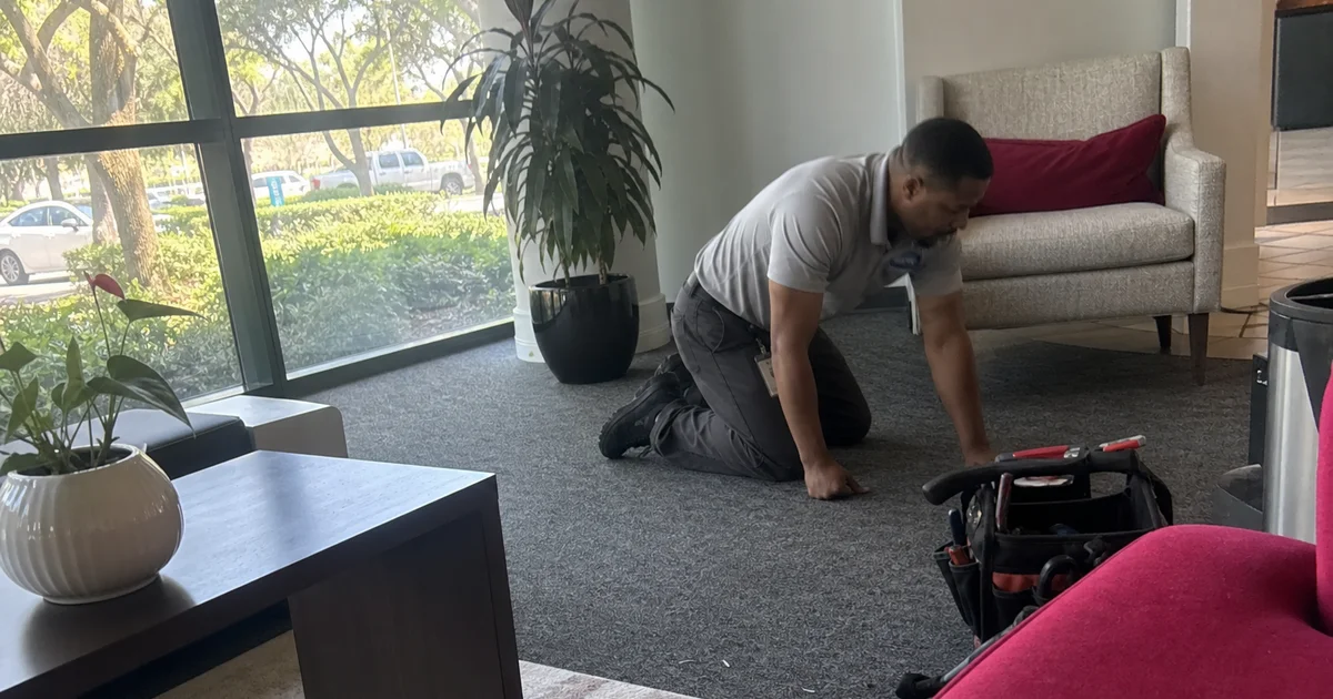 Handy Man West Hartford technician performing maintenance in a small office lobby in Avon, CT